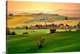 image thumbnail of Photograph of hillsides with mountain silhouettes in the background.  The hills are covered with homes, trees, bushes, and...