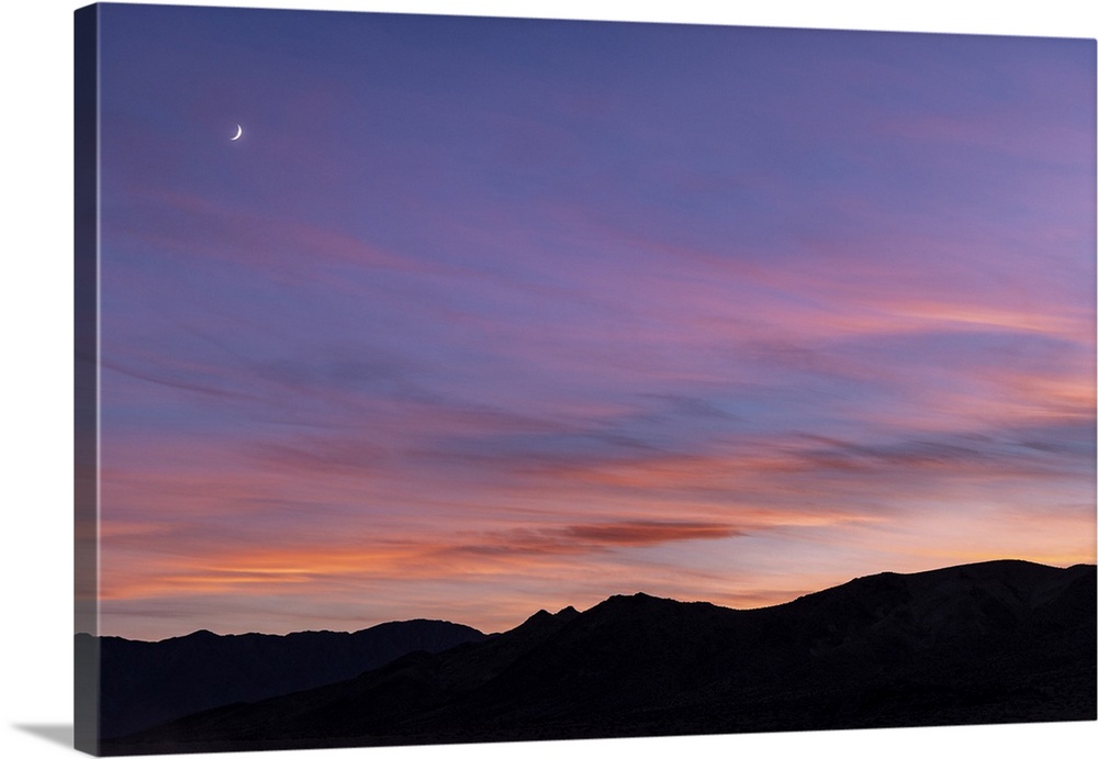Stunning sunset with moon at the Racetrack in Death Valley