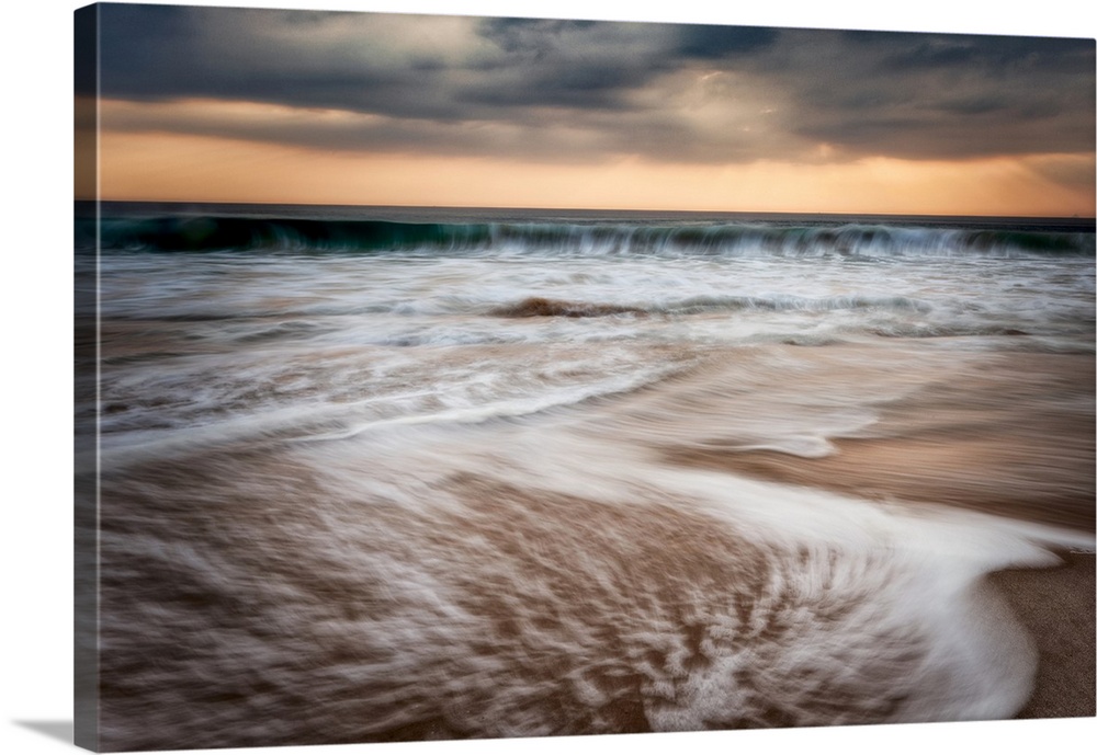 Sunset and waves crashing off the coast of Burma