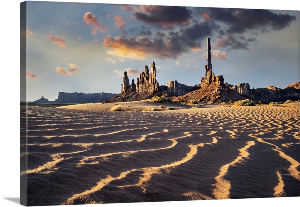 Totem Pole and Yei Be Chei at sunrise in Monument Valley