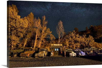 Vintage gas station and old cars after dark in the Palouse, Wash