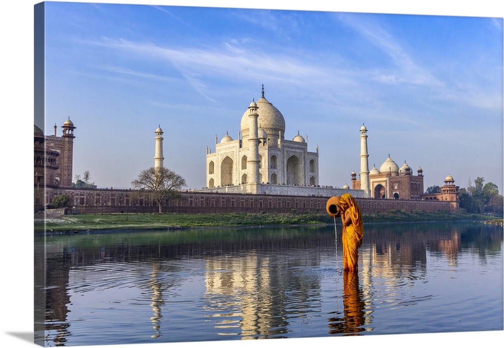 Woman gathering water behind the Taj Mahal