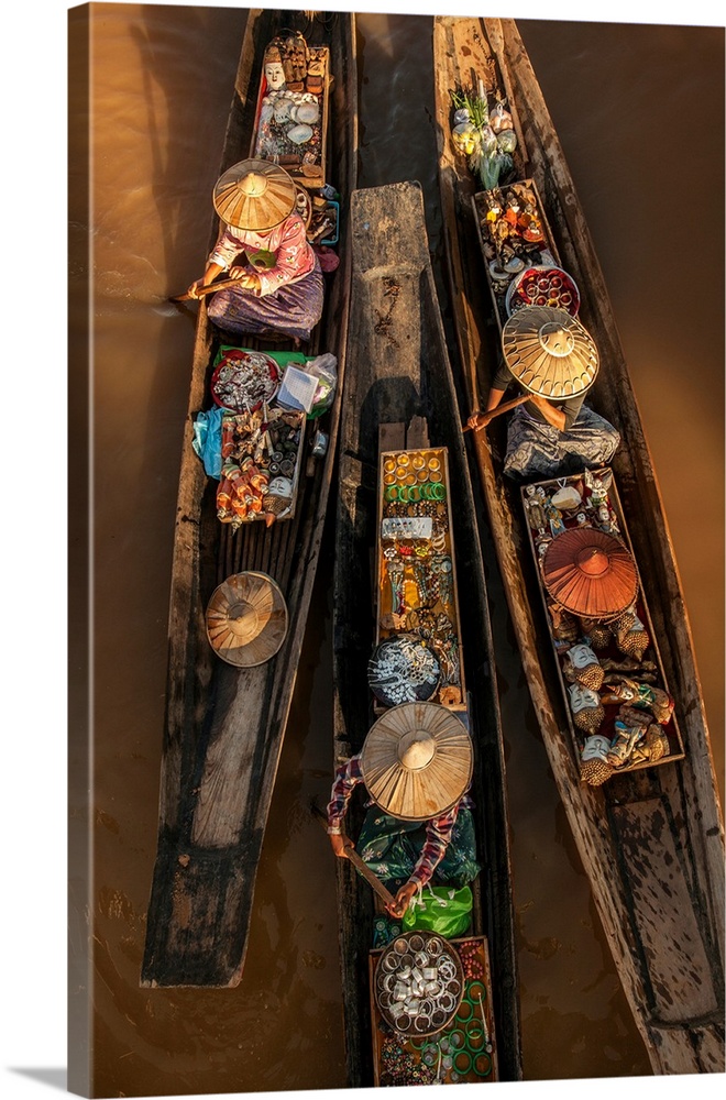 Woman on longtail boats selling jewelry in Burma.