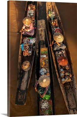 Woman on longtail boats selling jewelry in Burma