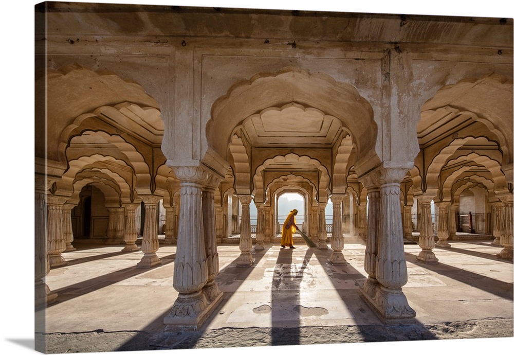 Woman sweeping in the Amber Fort in Jaipur, India.