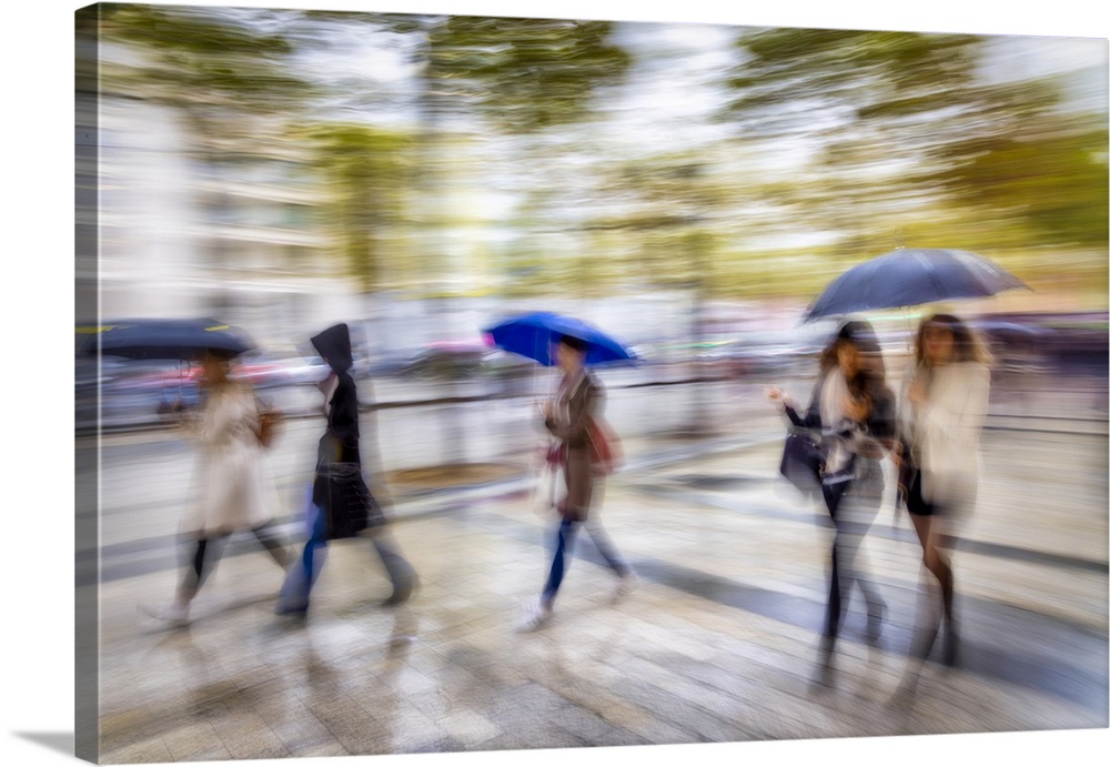 Women walking in the rain in Paris