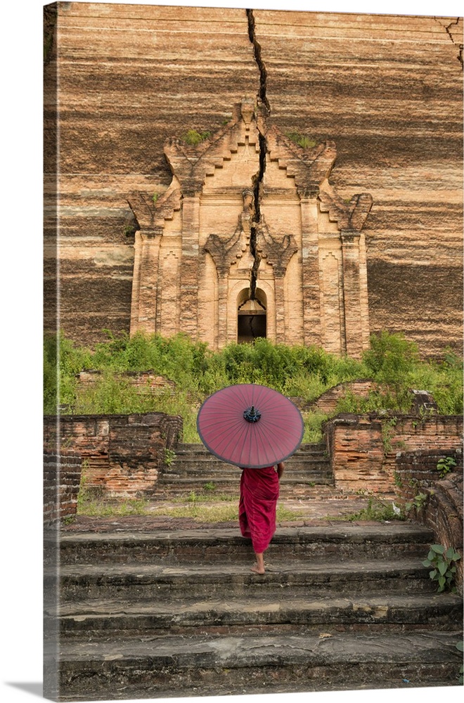 Young monk walking up Mingun Temple in Mandalay, Burma