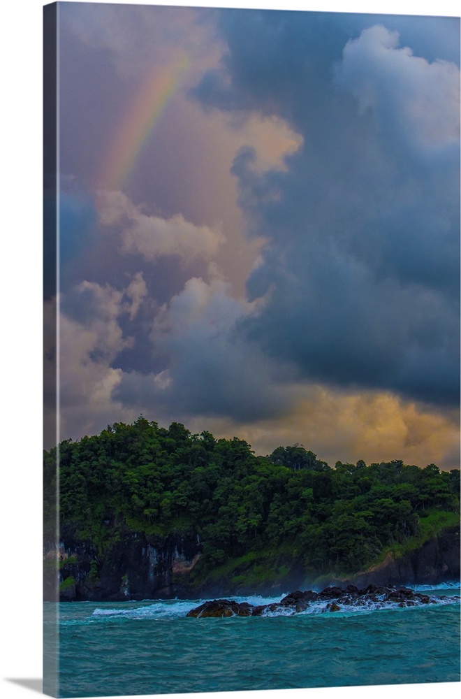 A rainbow appears between squalls on the wild coast of Costa Rica.