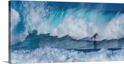 A Surfer On A Big Wave In Hawaii