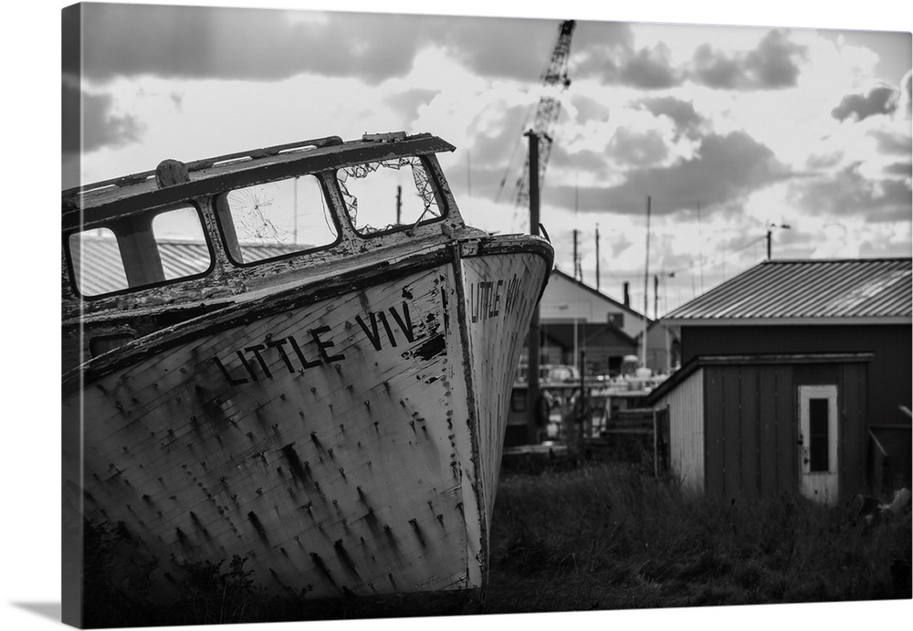 Black and white image of an old boat in its final resting place PEI Canada