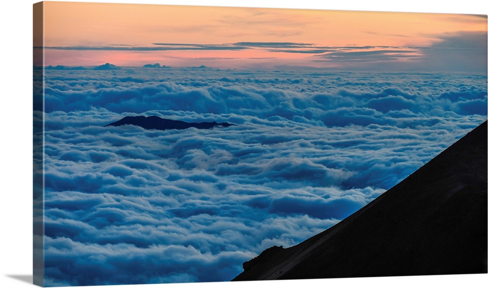 Big Island Hawaii. Clouds roll in along the slopes of the Mauna Kea volcano on Hawaii's big island.