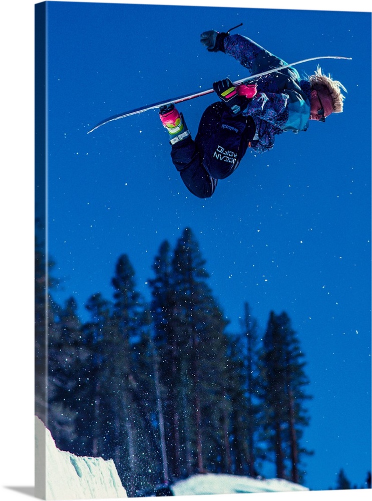 Damian Sanders grabs his snowboard in the air in June Mountain, June Lake, California.