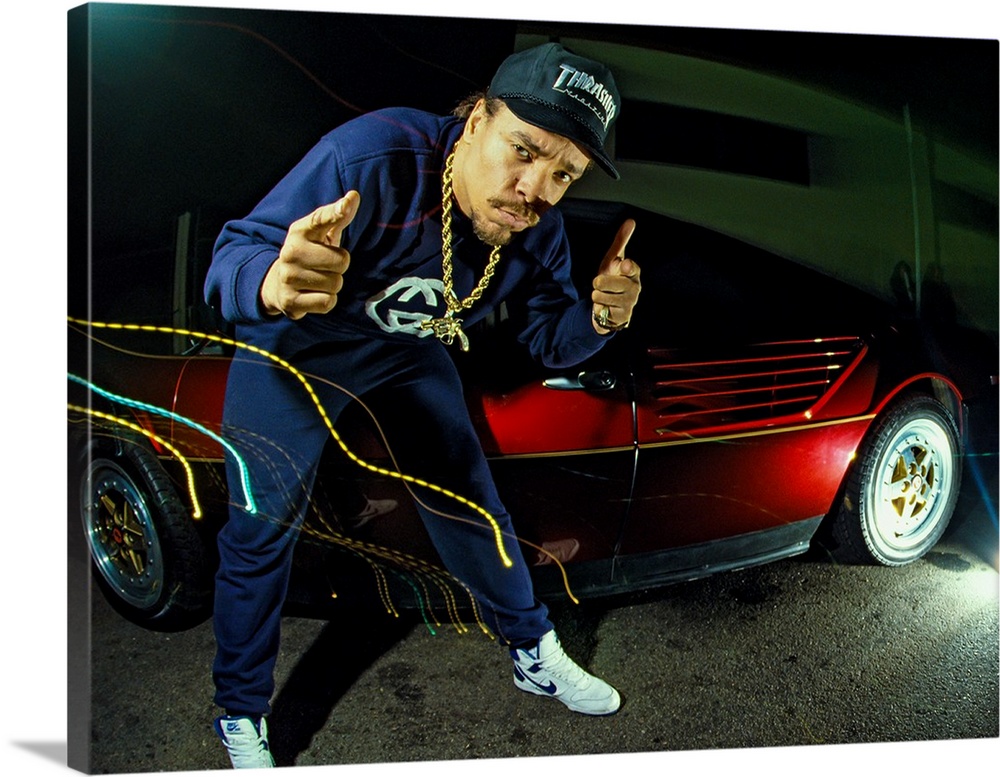 Rapper Ice-T posing with a cherry red car and light trail effects, Los Angeles, 1988.