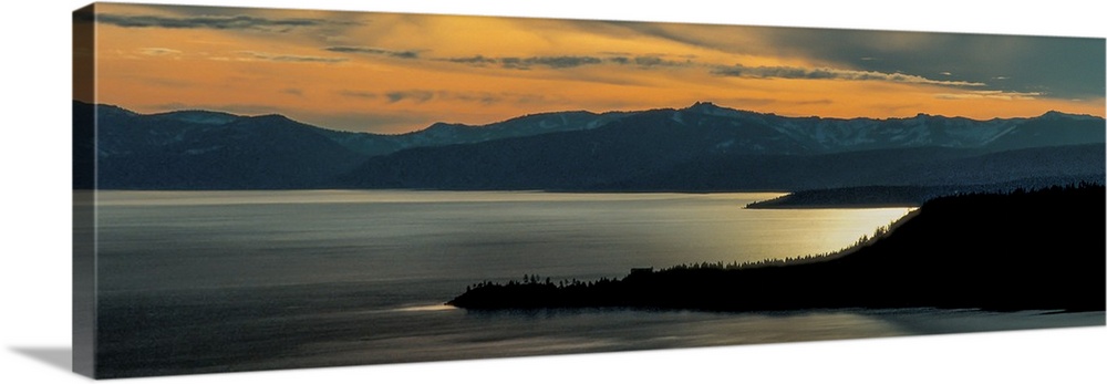 Panoramic view of Lake Tahoe at dusk with sunset light in the sky, California.