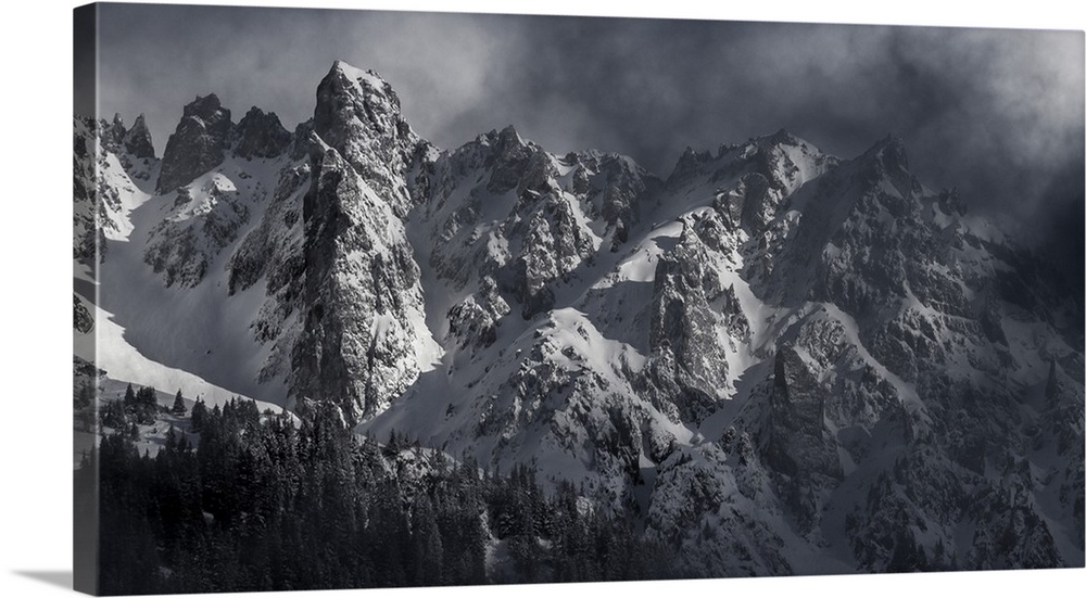 Black and white photograph of a snowy Mont Blanc on a hazy day.