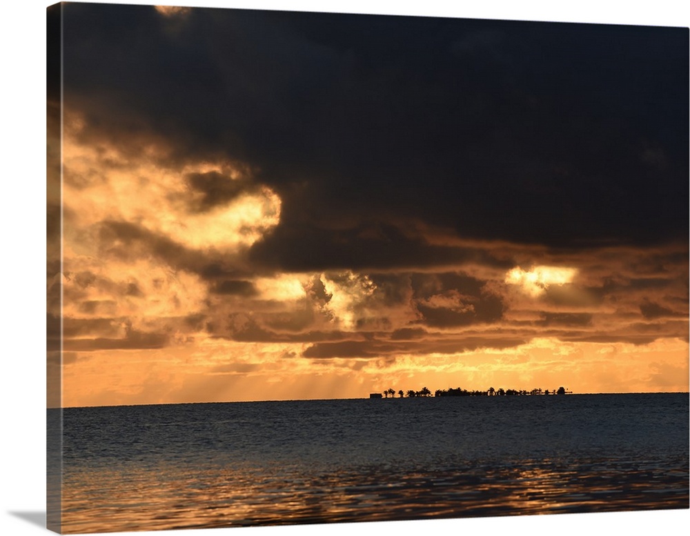Dark storm clouds over the ocean in Belize at sunset, Caribbean.