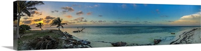 The sun sets above a remote caye in Belize