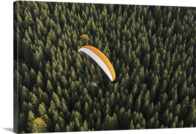 Aerial View Of Paramotor Flying Over The Forest In Poland