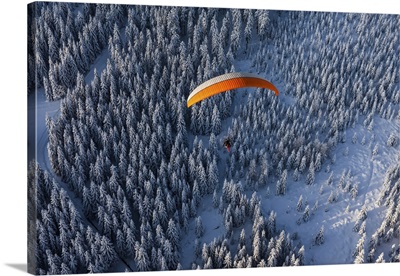 Aerial View Of Paramotor Flying Over The Forest In Winter, Poland