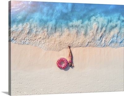Aerial View Of Woman With Pink Donut Ring On Sandy Beach, Sunset, Indian Ocean