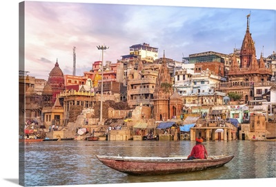 Ancient Varanasi City At Sunset With Sadhu Baba Enjoying A Boat Ride On The River Ganges