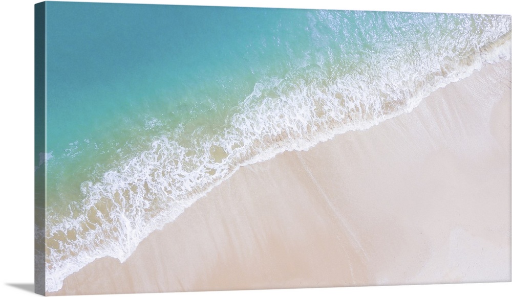 Beach top view or aerial view with shade emerald, blue water and wave foam, soft focus.