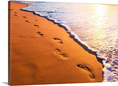 Beach, Waves, and Footprints at Sunset