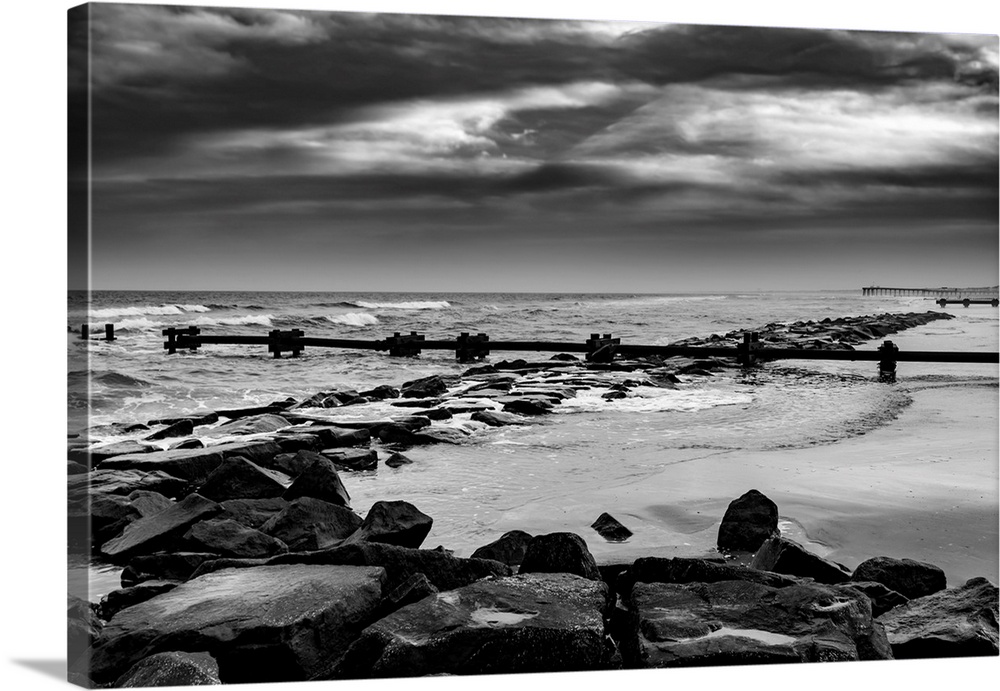 Black and white Jetty Rocks at Ocean City, New Jersey beach and boardwalk.