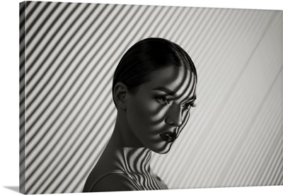 Black And White Portrait Of A Girl With A Striped Shadow Pattern On The Face And Body