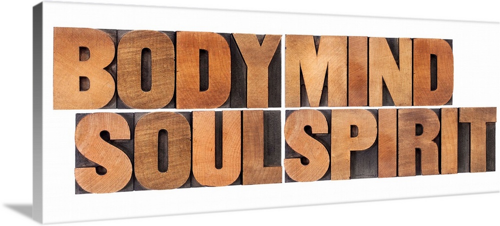 body, mind, soul and spirit - a collage of isolated words in vintage wood letterpress printing block