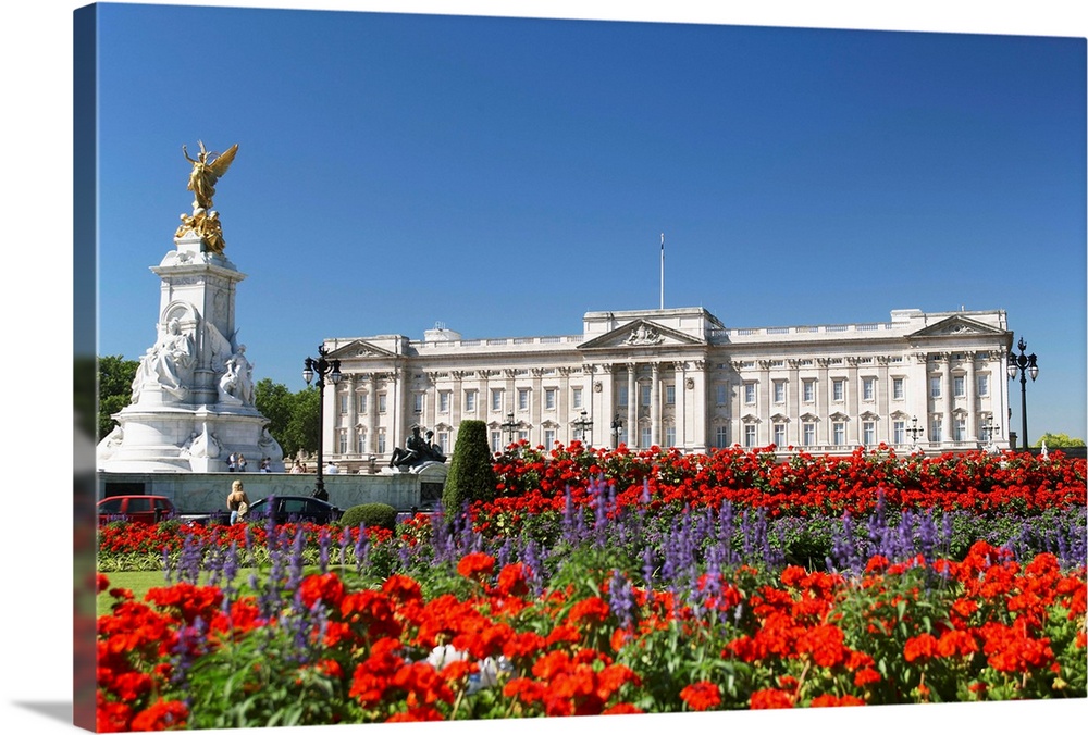 Buckingham Palace With Flowers Blooming In The Queen's Garden, London, England.