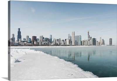 Chicago Downtown Panorama In Winter, Frozen Lake With Snow Covers Lake Michigan