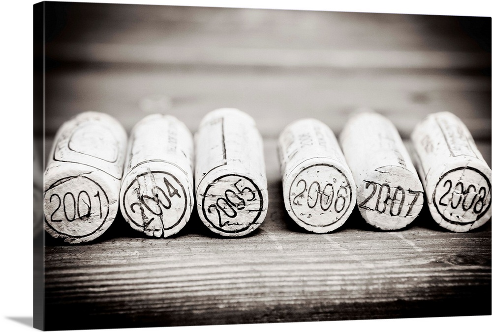 Dated Wine Bottle Corks On The Wooden Background