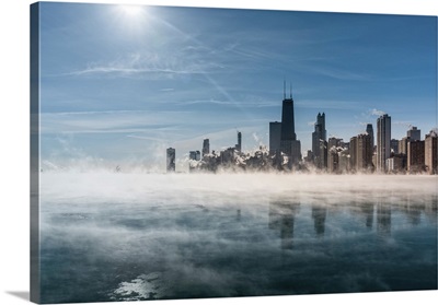 Downtown Chicago Skyline During Winter Polar Vortex As Fog Drifts Across Lake Michigan