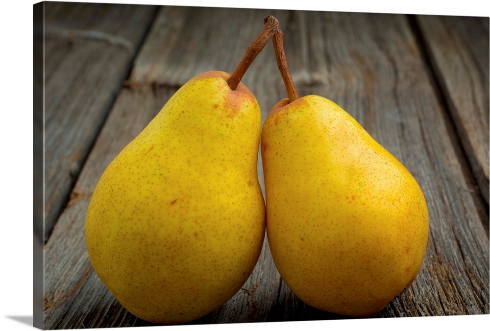 Fresh organic pears on old wood surface.