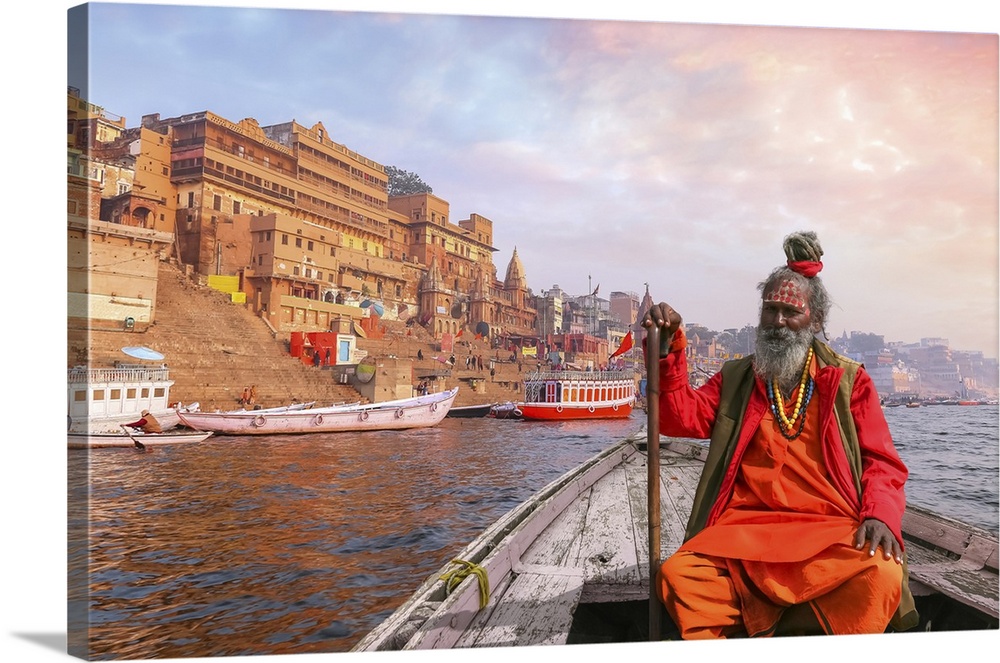 Indian Sadhu Baba Takes A Boat Ride On River Ganges Overlooking Varanasi City At Sunset