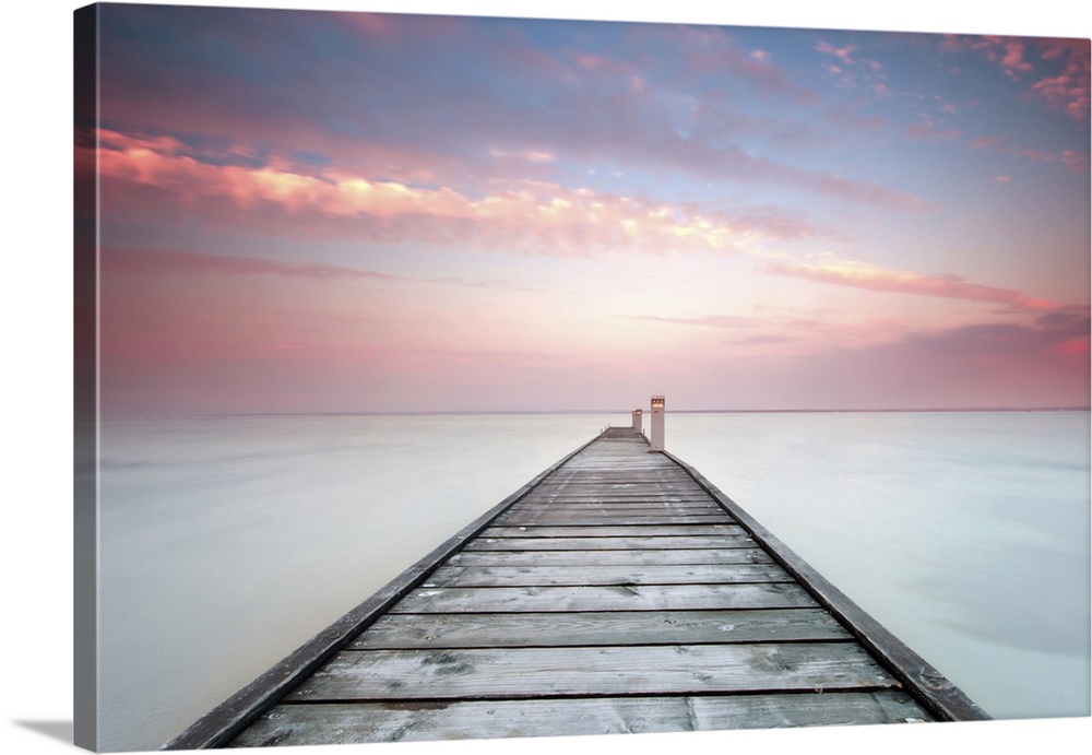 Long exposure shot of a minimalistic landscape with old jetty.