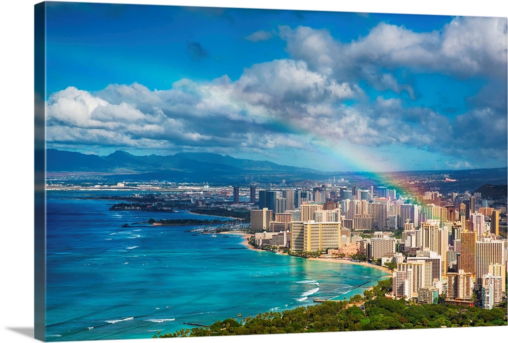 Beautiful rainbow over the Hawaii skyline and beach.