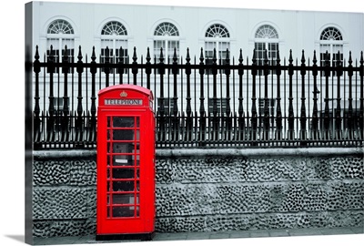 Red telephone box in street, London