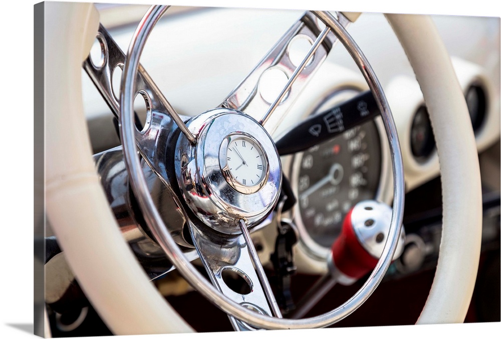 Steering wheel in interior of old vintage automobile.