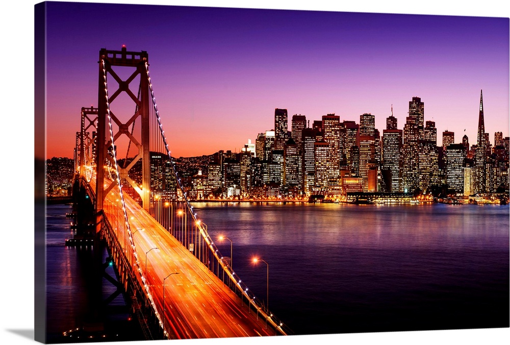 San Francisco skyline and Bay Bridge at sunset, California.