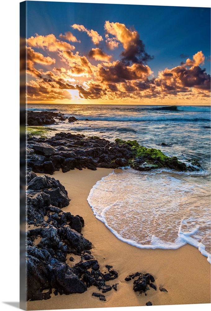Sunrise at the shore of Sandy Beach on Oahu, Hawaii.