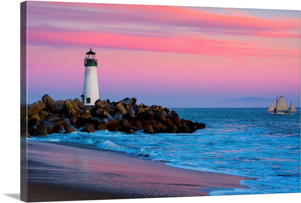 Santa Cruz Breakwater Lighthouse in Santa Cruz, California at sunset.