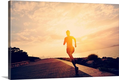 Silhouette of a runner at seaside