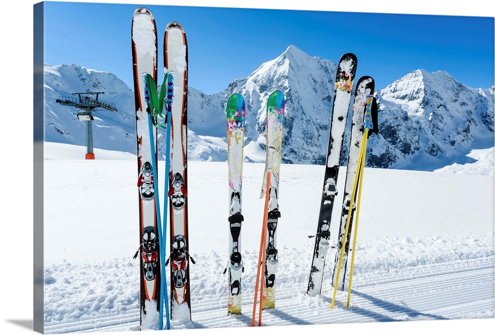 Skis sticking in the snow on a mountain slope..