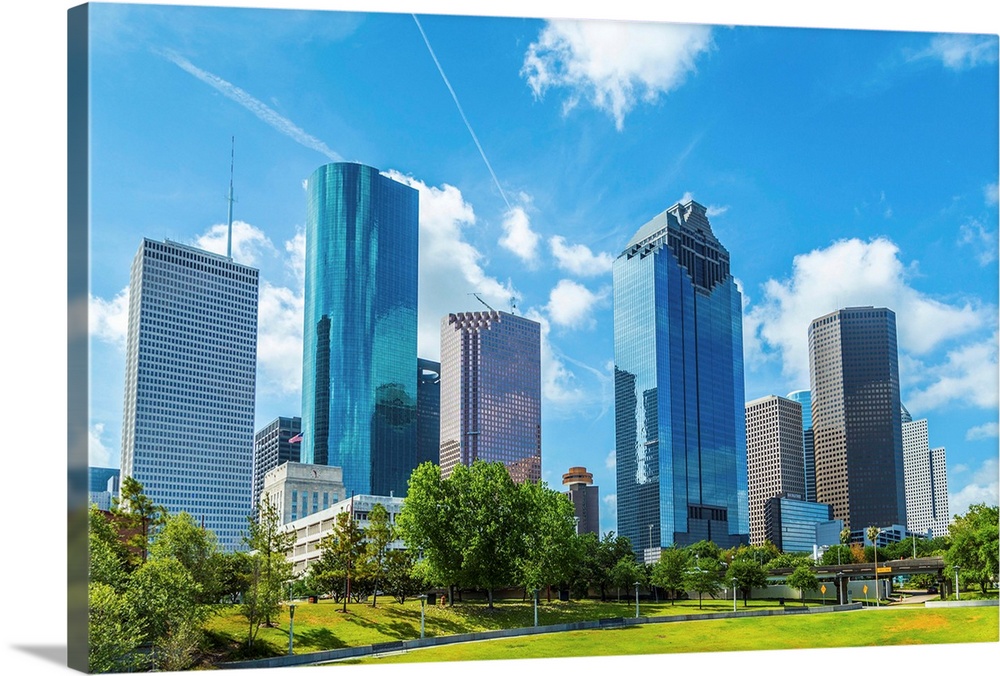 Skyline of Houston Texas in daytime under blue sky.