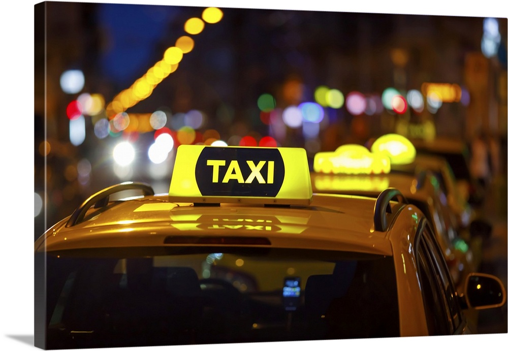 Taxi And Blurred City Lights At Night