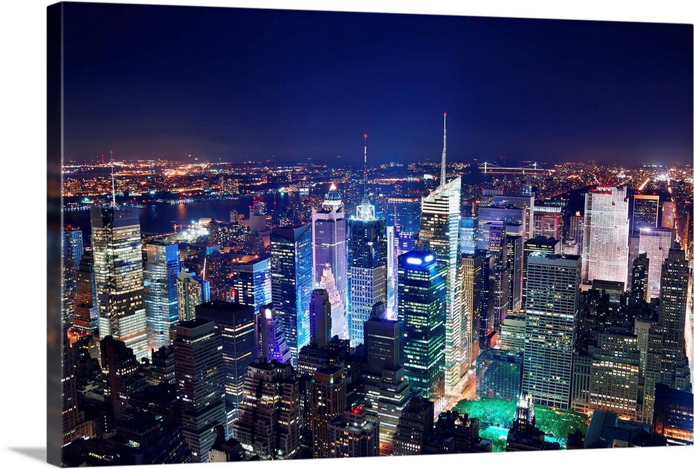 New York City Manhattan Times Square panorama aerial view at night with office building skyscrapers skyline illuminated by...