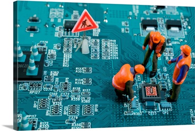 Tiny Engineers Fixing a Broken Chip on a Motherboard