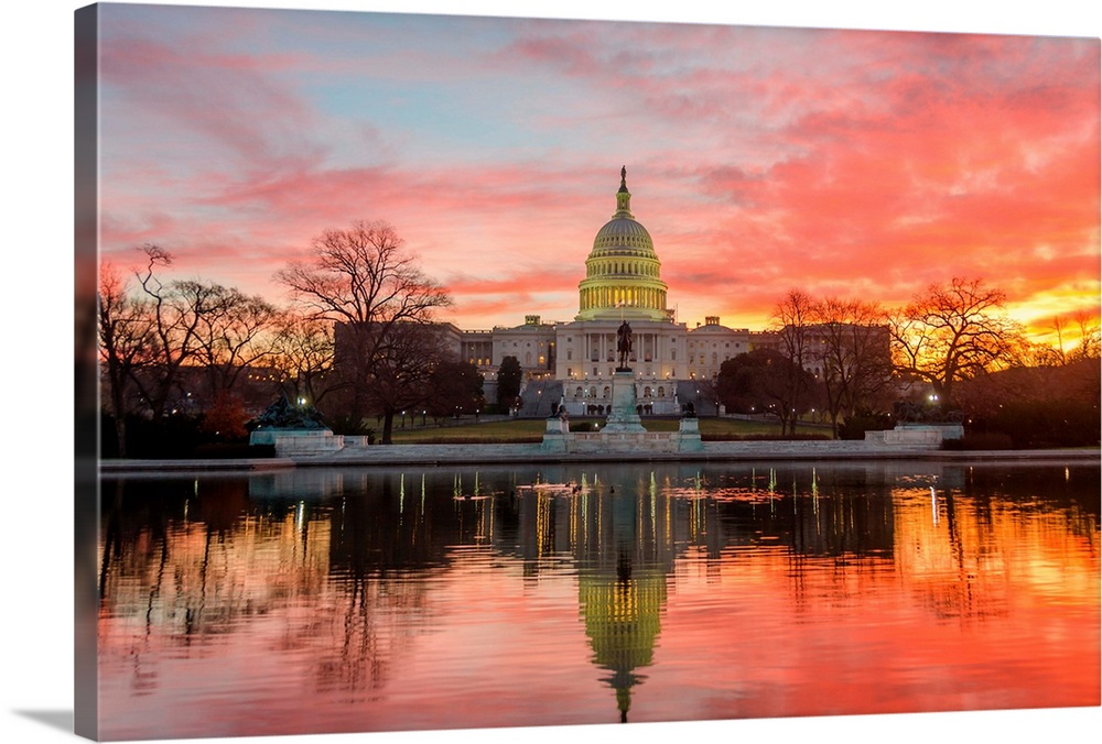 Washington DC, Capitol Building in a cloudy sunrise with mirrored reflection.